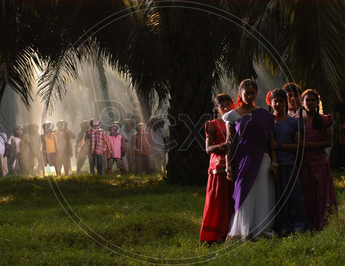 People Dancing with Head Pots in a Telugu Movie Song Shooting