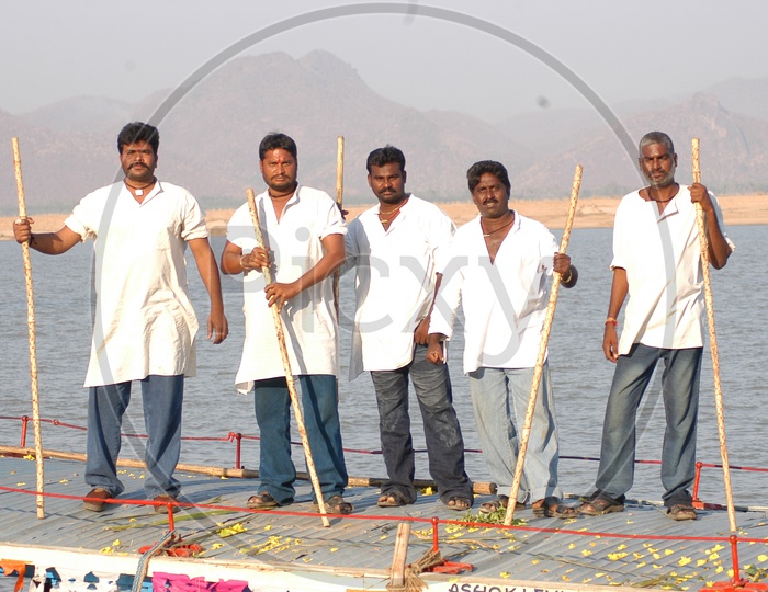 A Group Of Goons With Wooden Sticks In Hand in Movie Working Stills