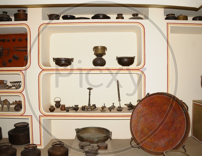 Gallery With Vintage Vessels And Weapons In Display At Amer Fort in Jaipur