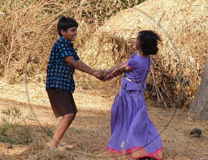 Image of Indian Brother and Sister Playing in a Rural Village-LD839078 ...