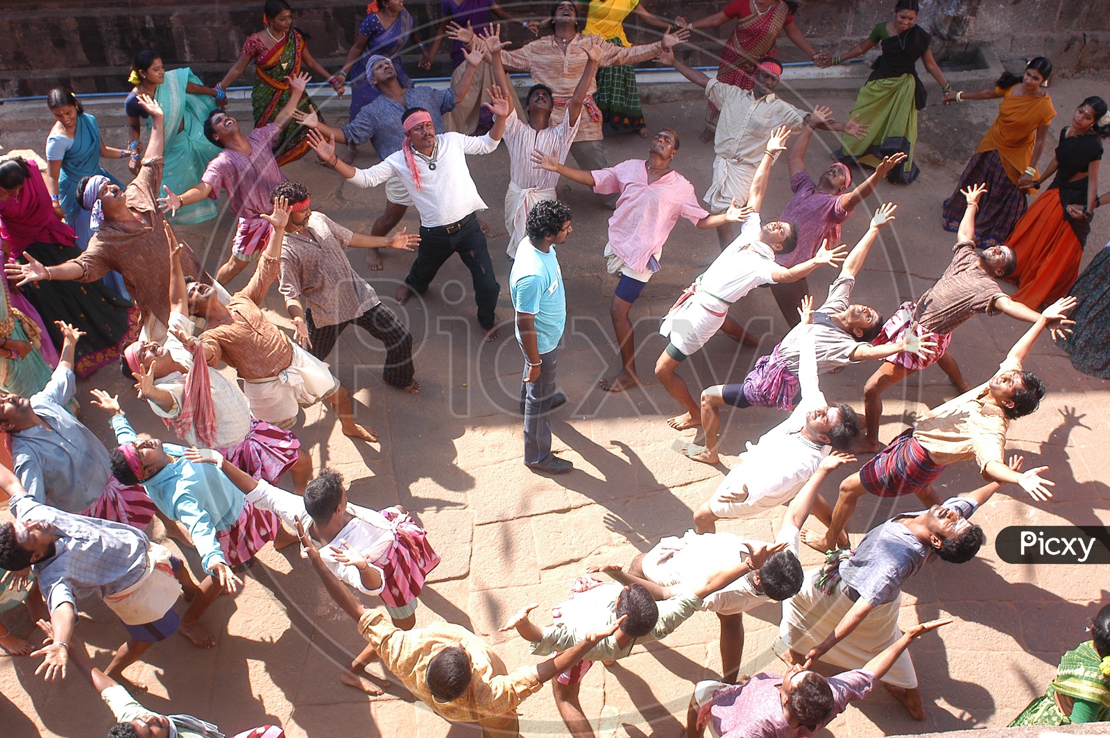 Group of Villagers Dancing In a Fest In a Movie Song Shoot Working Stills with Actor Uday Kiran