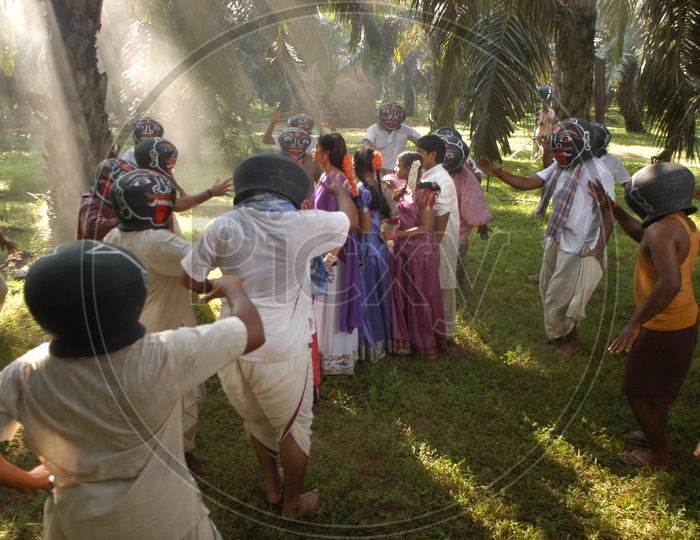 People Dancing with Head Pots in a Telugu Movie Song Shooting