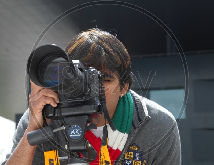 Tollywood Actor Ravi Teja With a DSLR  Camera In  Movie Working Stills