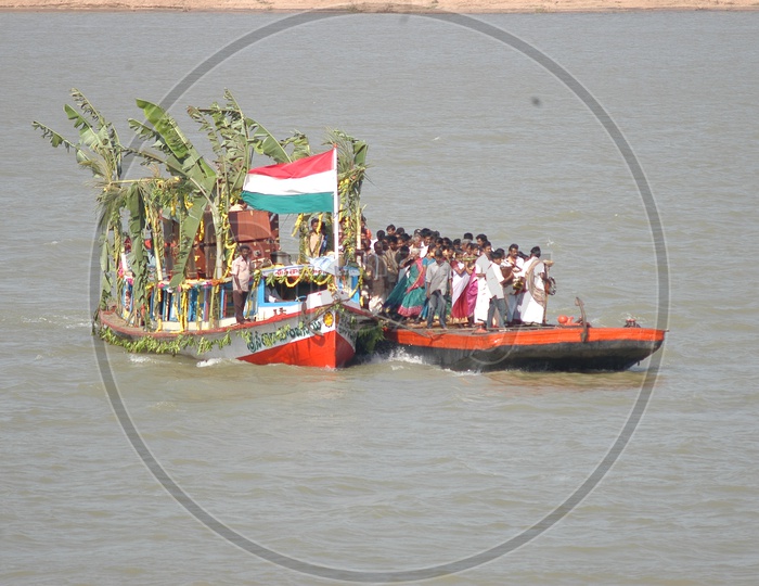 People traveling on Boat in Godavari River to Bhadrachalam Temple