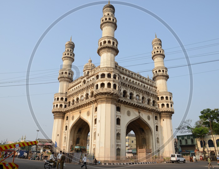 Charminar View With Vehicles Moving On Roads Around it