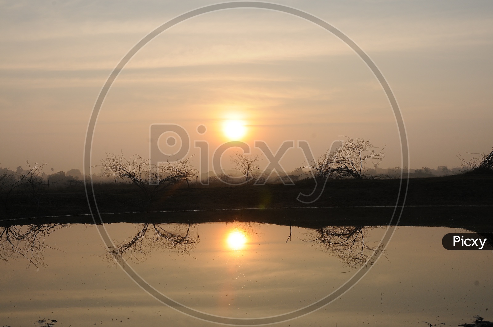 Reflection Of Sunset In a Lake At a rural Village