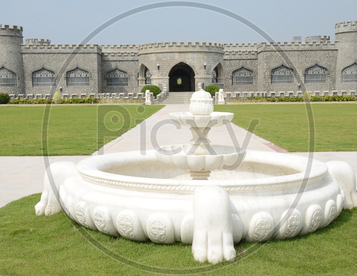 Architecture Of an Old Stone Built  Fort With Lawn Garden  And Fountain