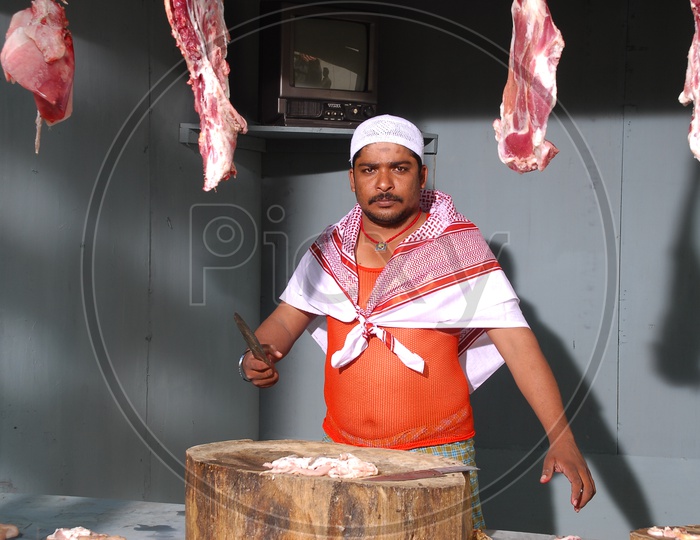 Butcher In a Meat Vending Stall In India