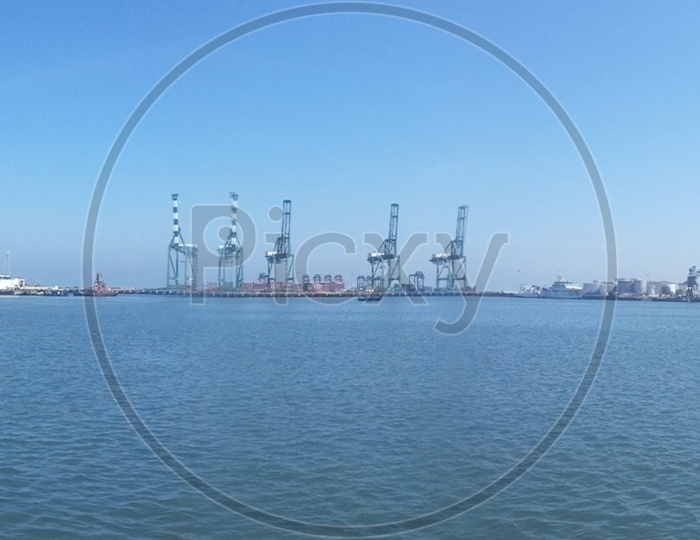 Panoramic View Of a Harbor With Ships And Heavy Cranes