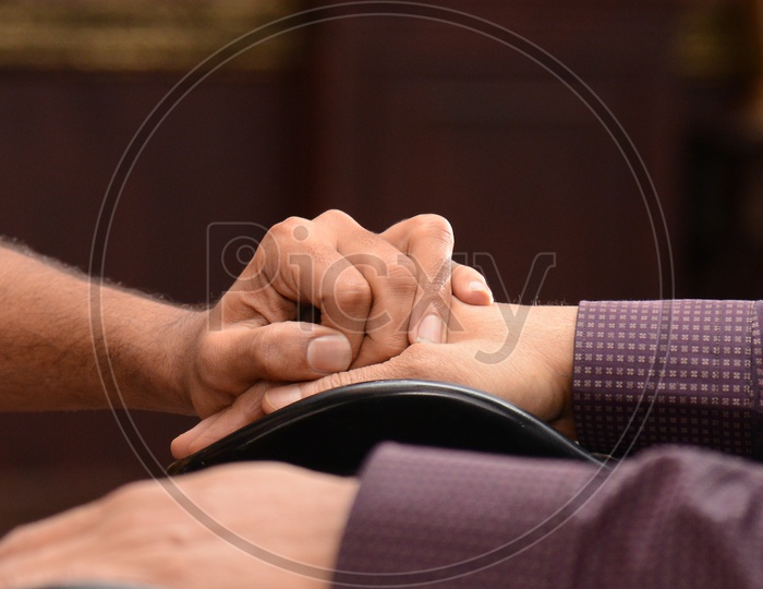 Handicapped Man Hand Holding By an Another Man Closeup