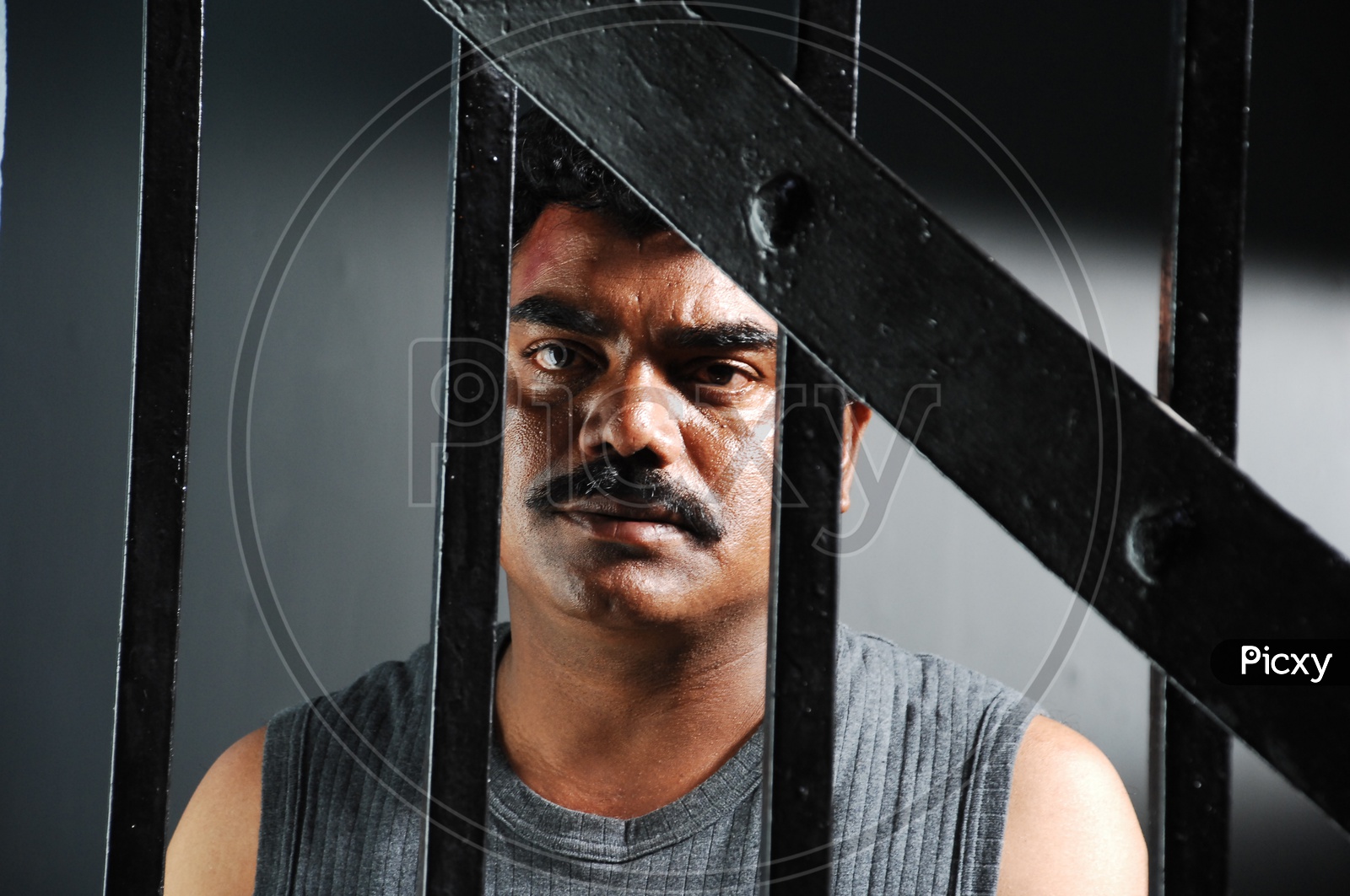 Image of Telugu Movie Character Artist Behind A Jail Bars In a Movie ...