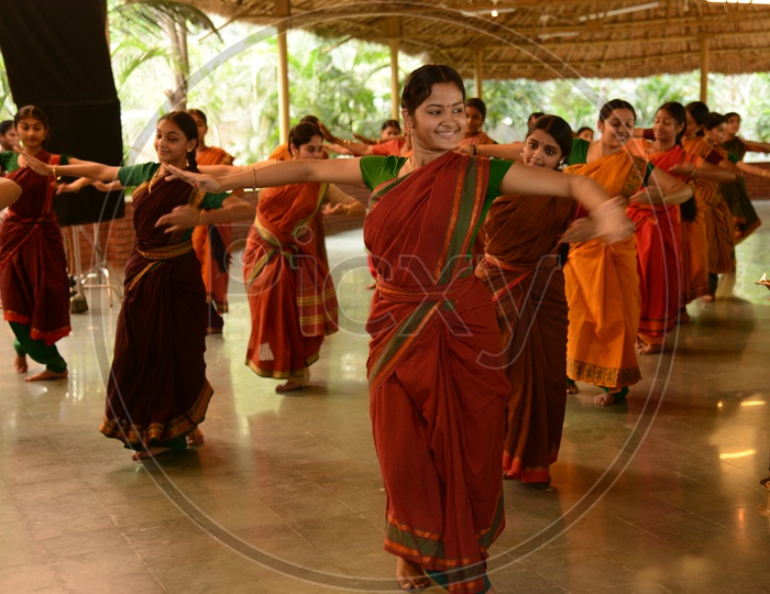 Indian Woman Practicing Bharathanatyam Classical Dance in a Class
