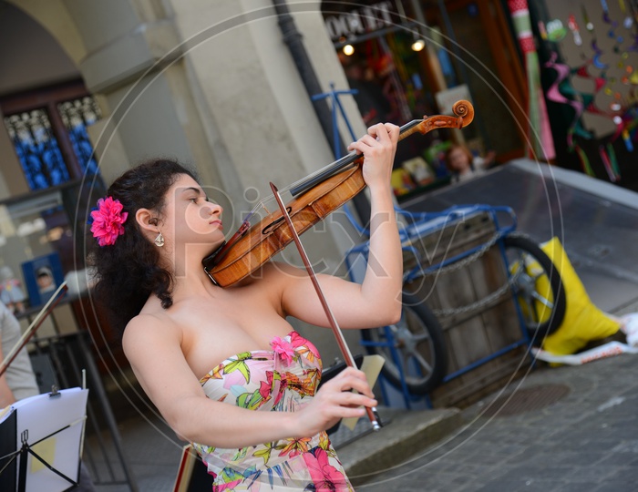 A Street Artist Playing Violin On Paris Streets