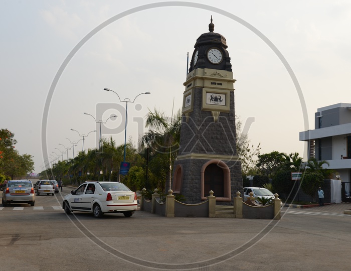 Tower Clock At a Road Junction With Cars