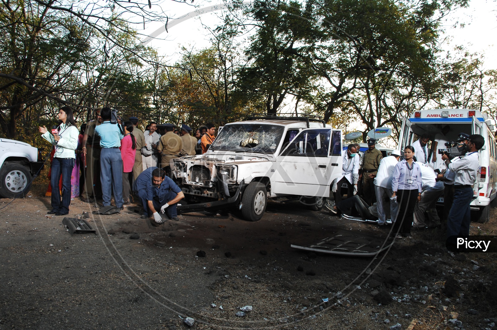 Police officers and Forensic Department Inspecting the Car Bomb Blast Spot
