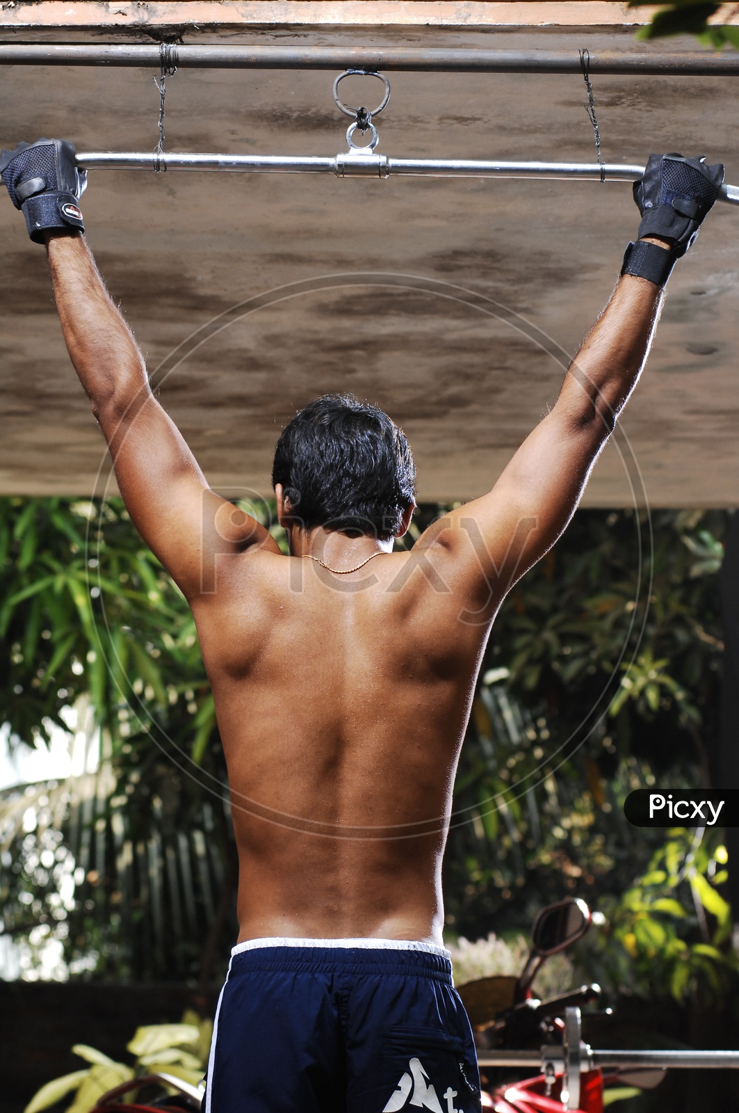 Young Indian Man with Six Pack doing Exercise