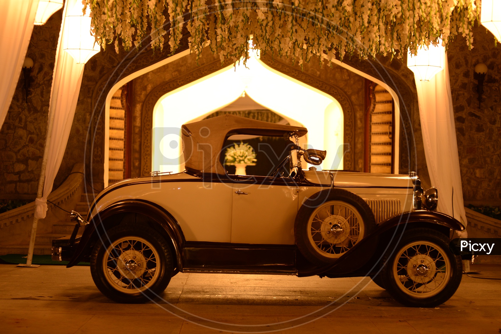 An Old Vintage Car At a House Compound