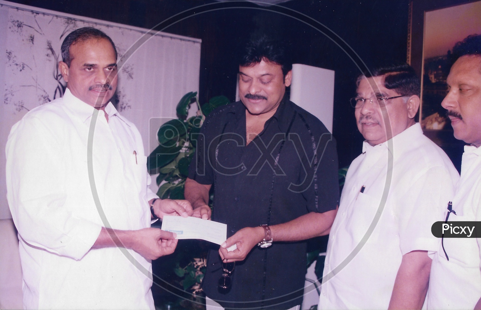 Image of Indian Film Actor Chiranjeevi Giving Cheque to Former ...