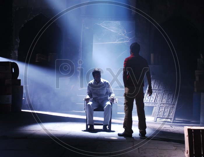 An Unidentified Person Tied to Chair, Telugu Movie Shooting Scenes