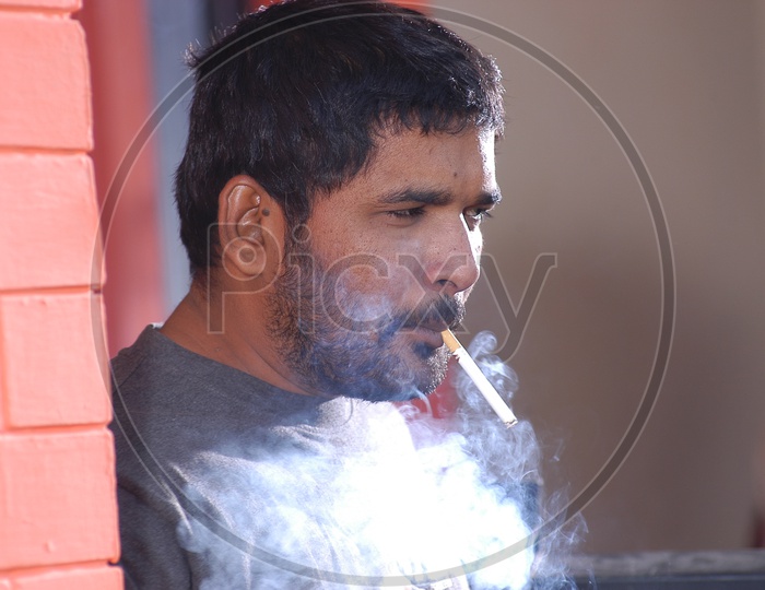 Closeup Shot of Young Indian Man Smoking