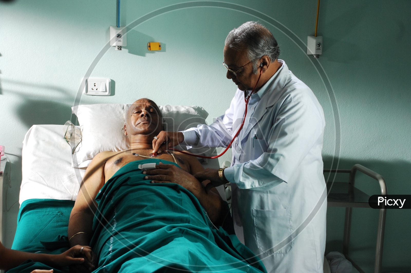A Doctor Treating Patient in Hospital