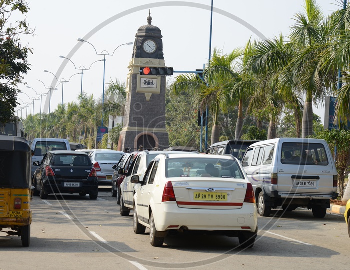 Tower Clock At a Road Junction With Cars