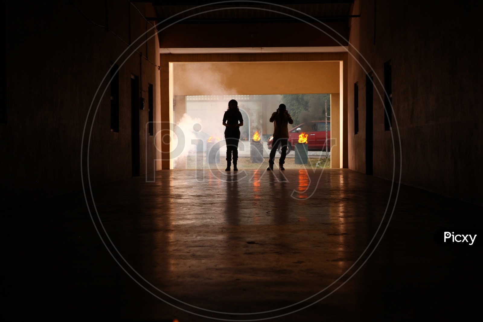 Silhouette Of Couple Walking In a Corridor