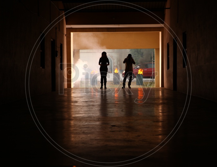 Silhouette Of Couple Walking In a Corridor