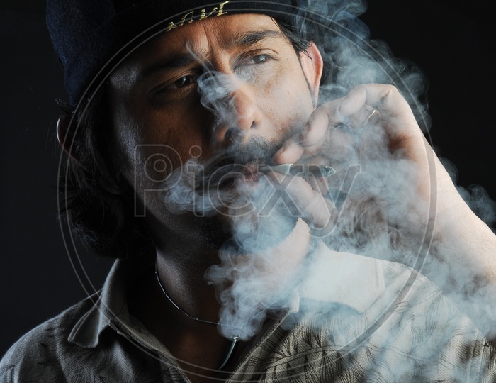 Indian Man Smoking a Cigarette