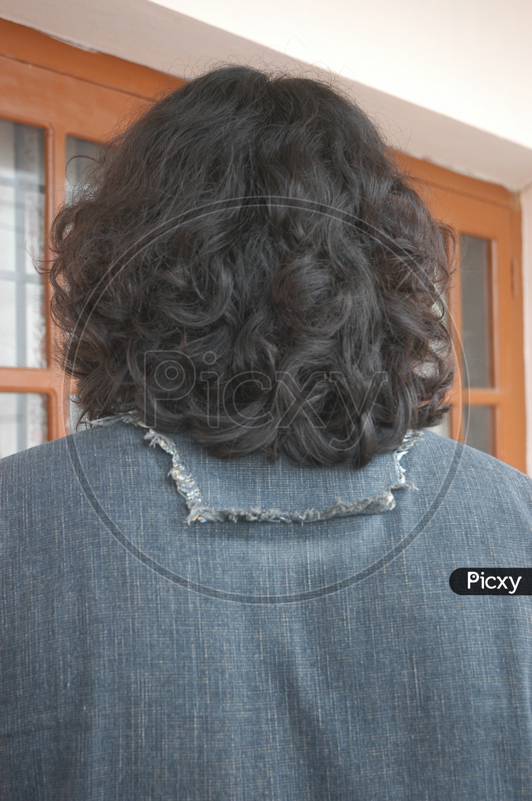 Back View Of Stylish Man With Long Hair Sit At Mock Up Laptop In Cafe And  Check Email And Social Network After Shopping In Emporium Live With  Internet Technology Stock Photo Picture