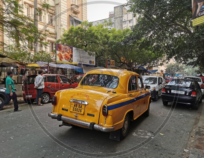 Yellow Taxi In Kolkata City Roads