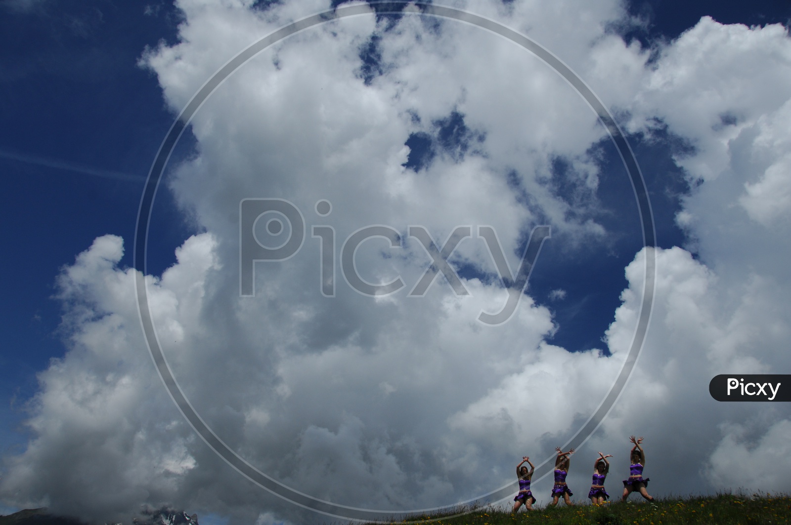 Group of Dancers Dancing On Swiss Alps In a Song Shoot