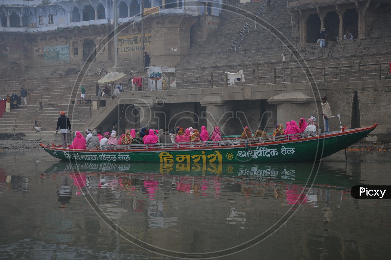 Ghats i  Varanasi in Morning Fog And Boats on River Godavari