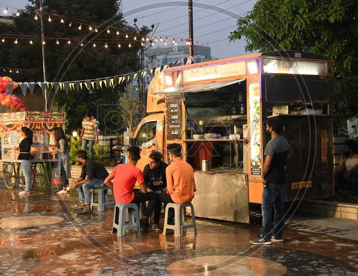 Food Trucks At a Food Court With People Eating