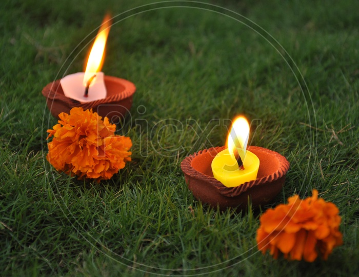 Lighting  candles during Diwali festival