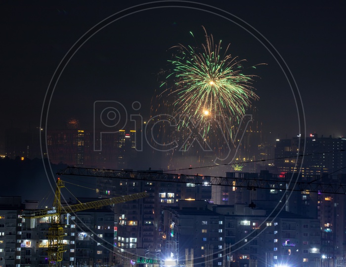 Indian Festival Diwali Deepavali Celebrations In Hyderabad With Crackers Bursting In The Sky On Top Of High Rise Buildings