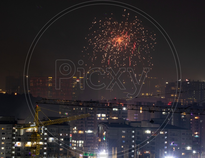 Indian Festival Diwali Deepavali Celebrations In Hyderabad With Crackers Bursting In The Sky On Top Of High Rise Buildings