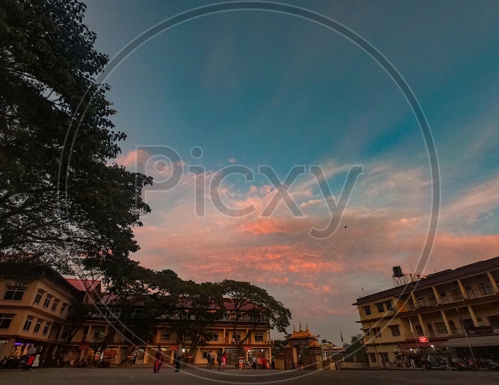 Residential Apartment Of Buddhist Monks At Namdroling Monastery With Sunset Sky