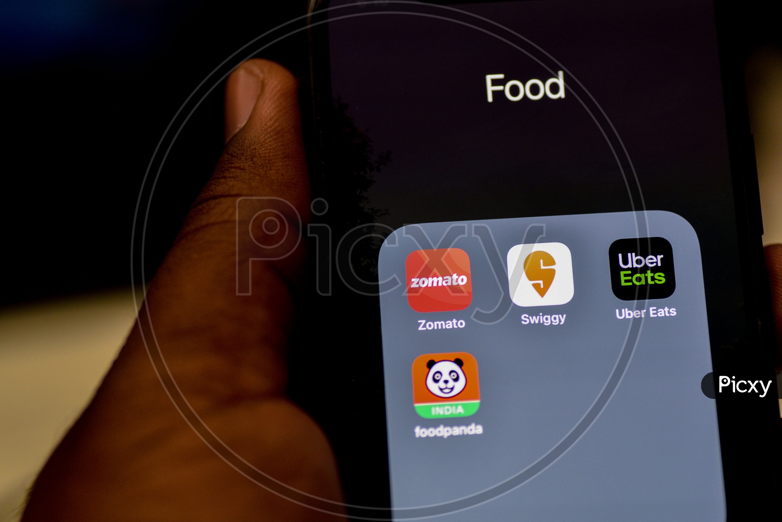 Online Food Ordering Or Delivering Apps Or Applications Icons On a Smartphone Screen With Selective Focus