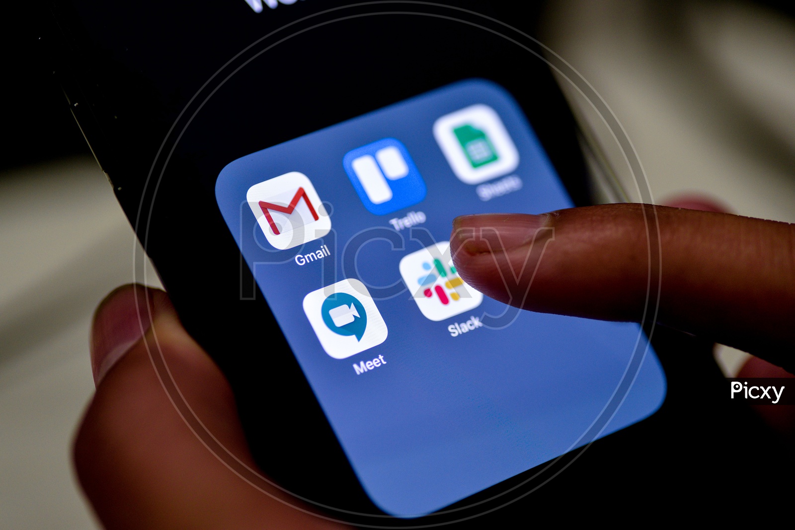 Man Finger Opening Slack  App On Smartphone Screen Closeup
