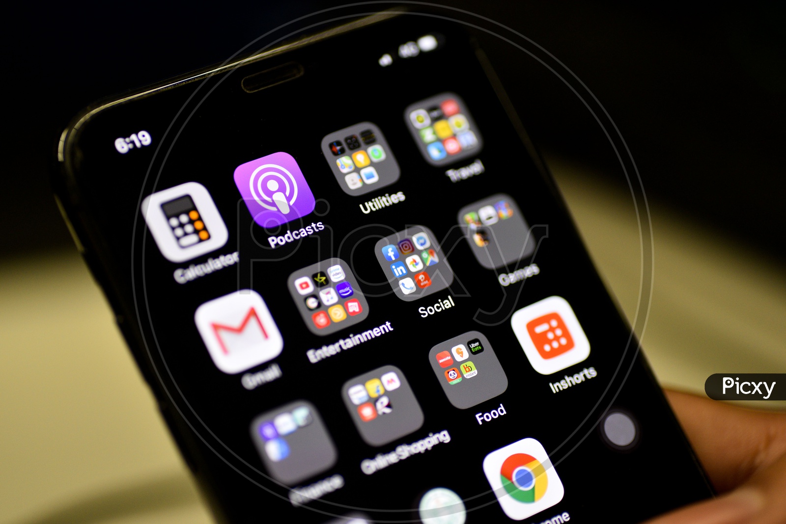 Installed Mobile Apps  or Applications Icons Arranged In an Organised  Way In Folders On Smartphone Screen With Selective Focus