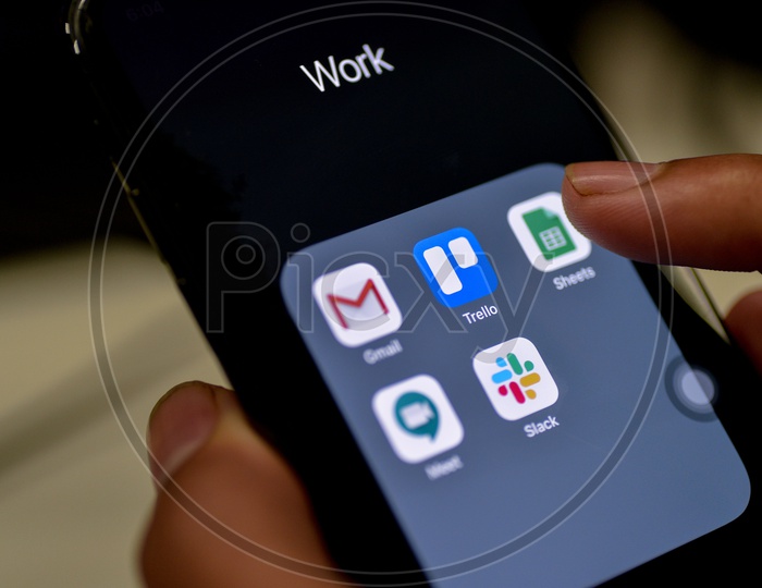 Man Finger Opening Google Sheets  App On Smartphone Screen Closeup