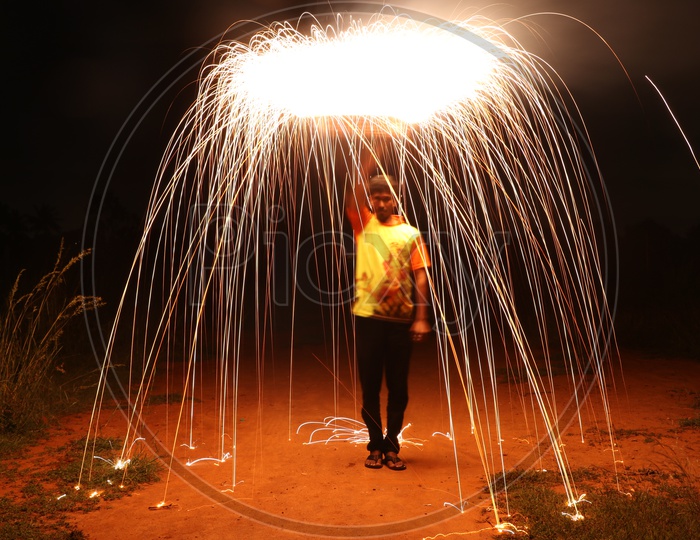 Firewool Photography With a Man Making Circles And Sparkles