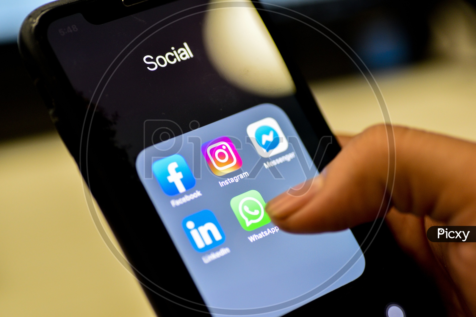 Social Network Apps On a Smartphone Screen Closeup With Man Finger On Whatsapp  Icon