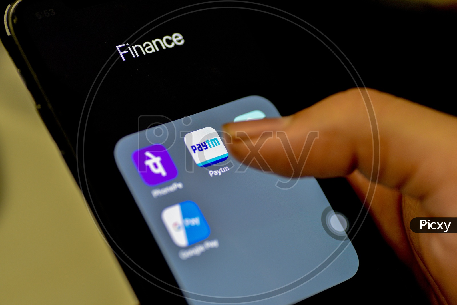 Online Payment, UPI or Bhim Payment and Transaction Apps Installed Icons On a Smartphone Screen Closeup With Man Finger Opening Paytm  App