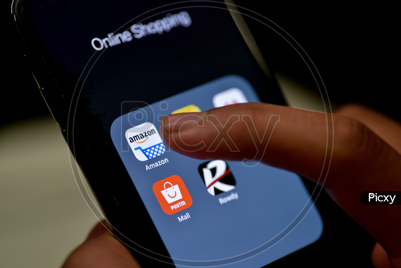 Man Finger Opening Amazon   Online Shopping App On Smartphone With Selective Focus