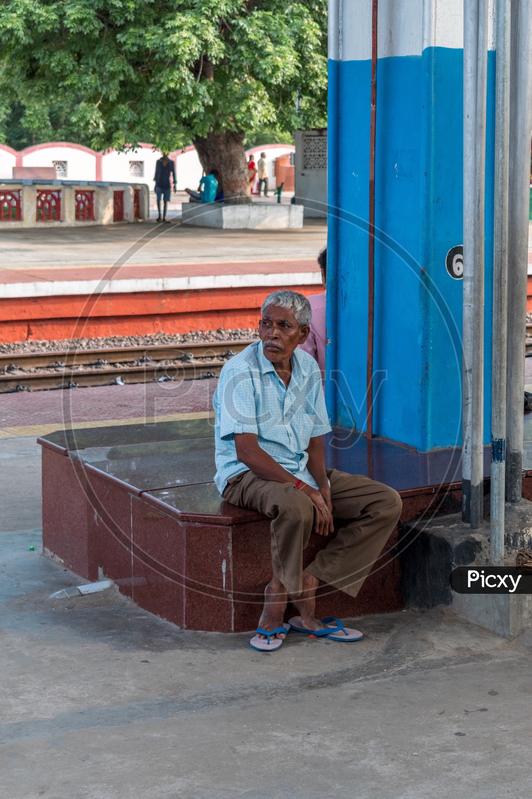Man sitting at railway station