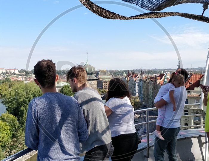 Tourists Enjoying The City Scape From View Point In Prague