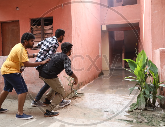 Indian Young Man Teasing a Girl By Hiding And Looking Secretly At a Residential Apartment
