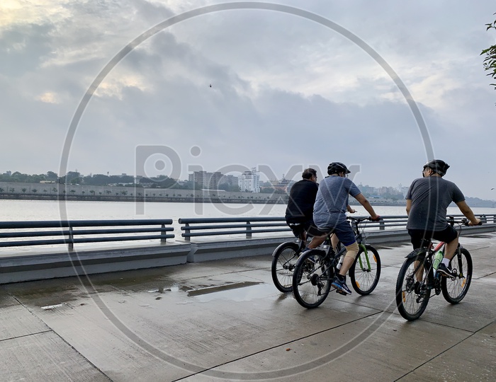 group of cyclist,cycling near riverside